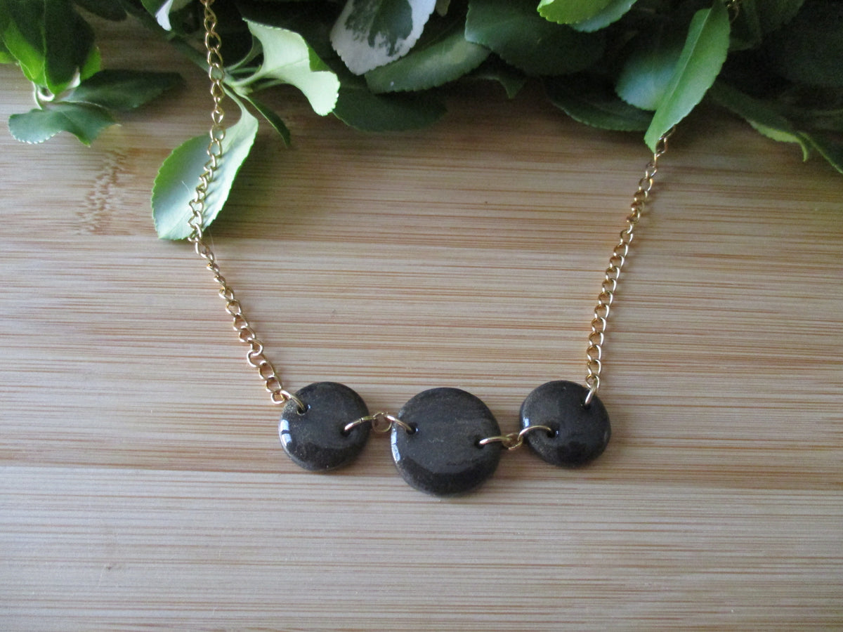Collier Eclipse en pâte polymère et acier inoxydable 304. Fait main.