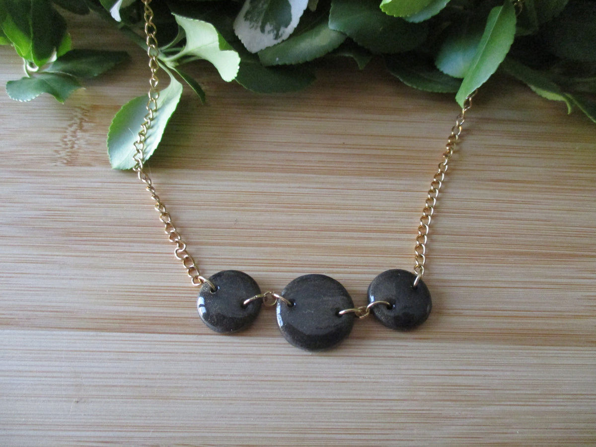 Collier Eclipse en pâte polymère et acier inoxydable 304. Fait main.